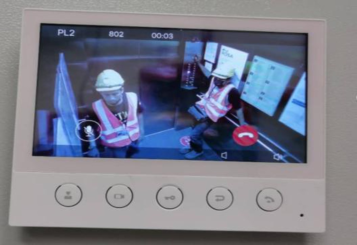 Indoor intercom station showing a live camera call from inside a lift car