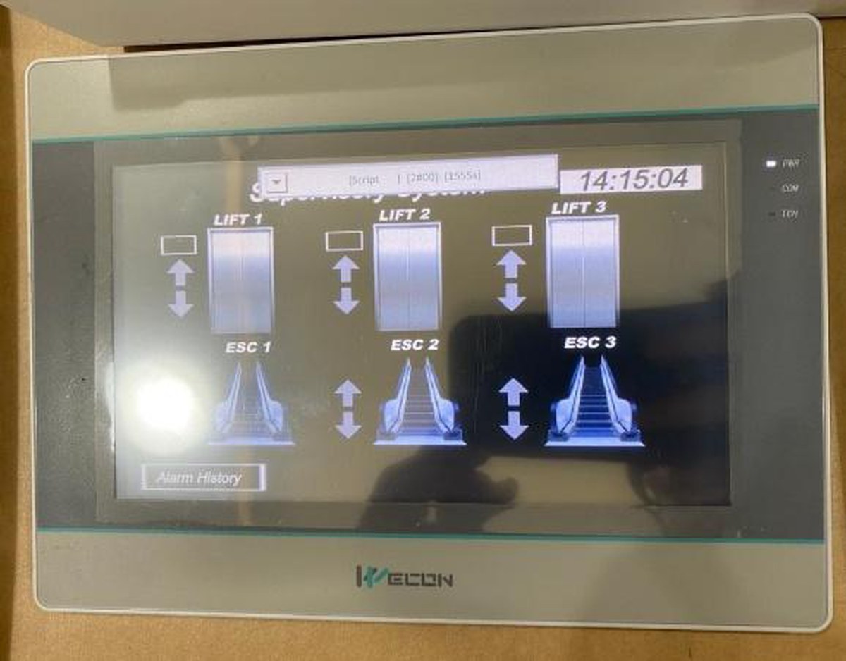 Lift supervisory touchscreen showing three lifts and three escalators live